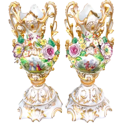Pair of porcelain vases with two handles, featuring flowers in relief and plant motifs