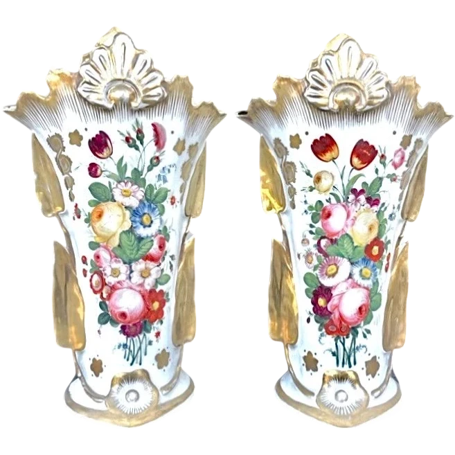 Pair of trumpet-shaped porcelain vases with leaf-shaped handles and floral motifs in relief