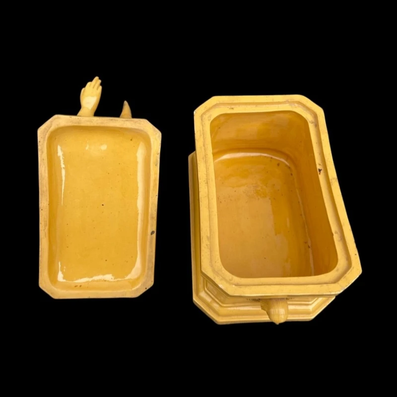 Mustard-colored earthenware box decorated with sphinxes and neoclassical motifs.