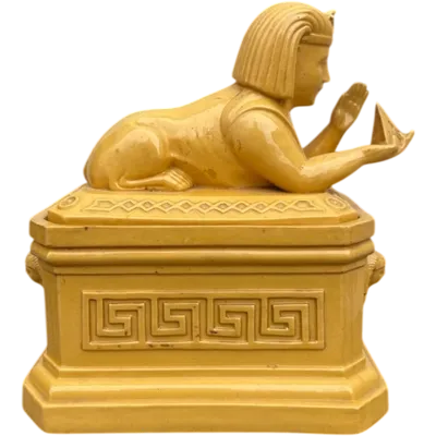 Mustard-colored earthenware box decorated with sphinxes and neoclassical motifs.