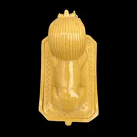 Mustard-colored earthenware box decorated with sphinxes and neoclassical motifs.