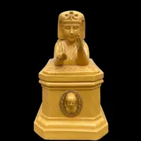 Mustard-colored earthenware box decorated with sphinxes and neoclassical motifs.