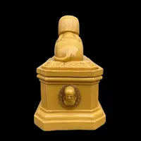 Mustard-colored earthenware box decorated with sphinxes and neoclassical motifs.