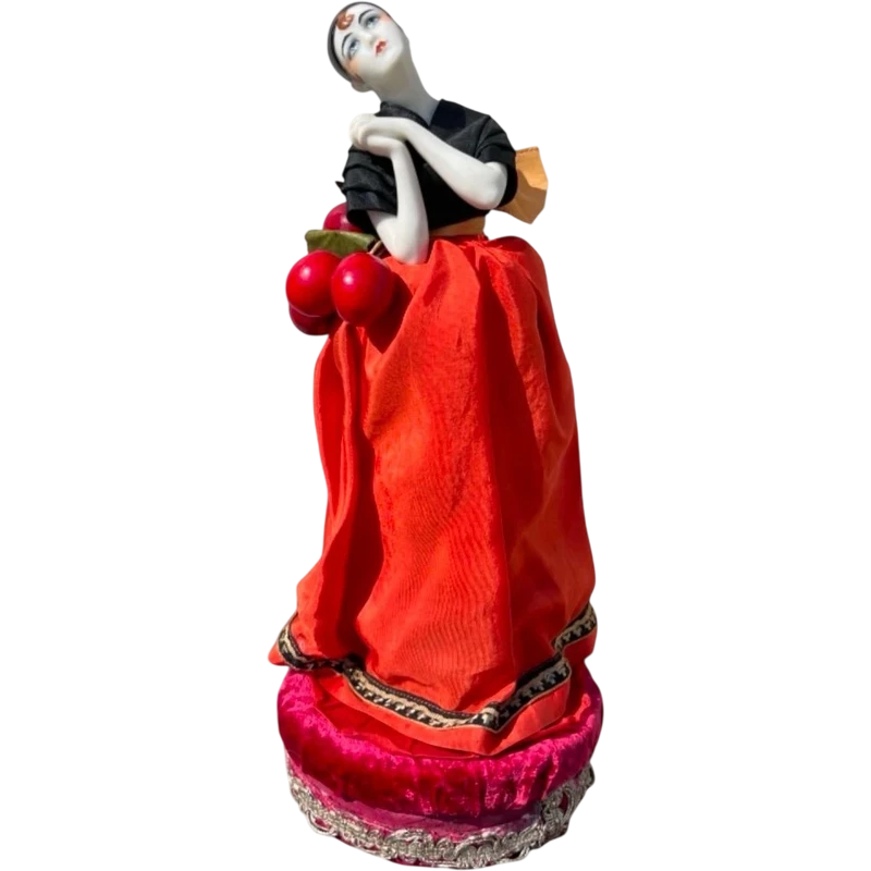 "Half Doll" porcelain powder compact featuring a Pierrot figure.