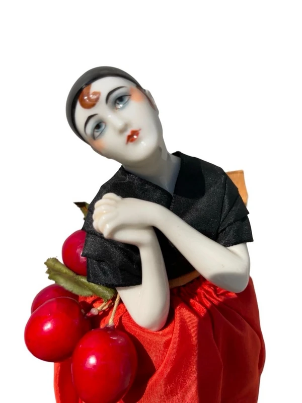 "Half Doll" porcelain powder compact featuring a Pierrot figure.