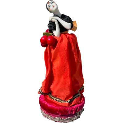 "Half Doll" porcelain powder compact featuring a Pierrot figure.