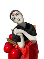 "Half Doll" porcelain powder compact featuring a Pierrot figure.