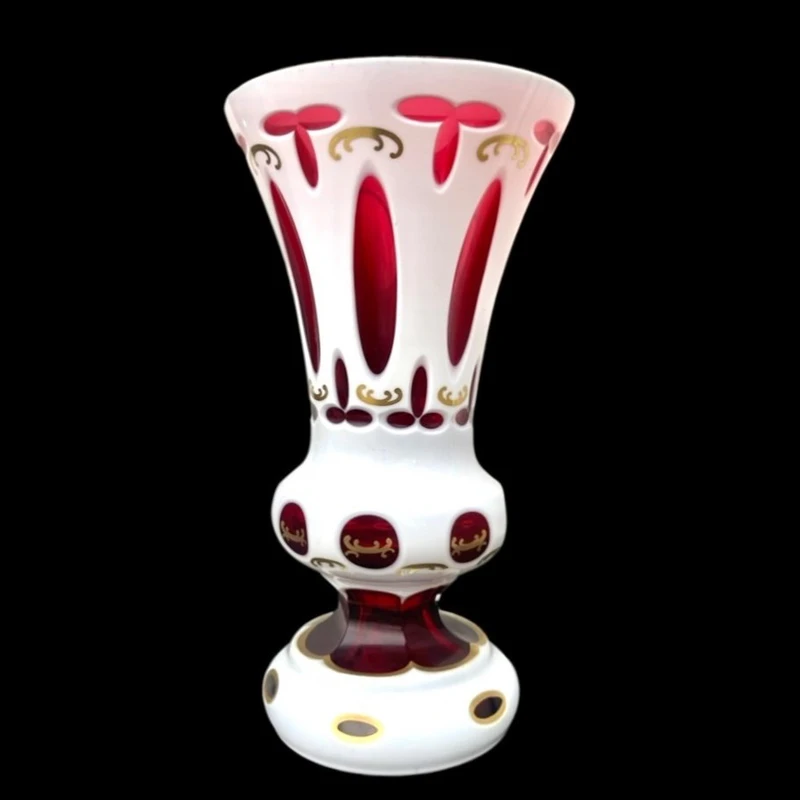 Double-walled, faceted crystal vase with a gilded medallion depicting a folk motif