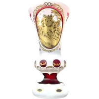 Double-walled, faceted crystal vase with a gilded medallion depicting a folk motif