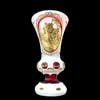 Double-walled, faceted crystal vase with a gilded medallion depicting a folk motif