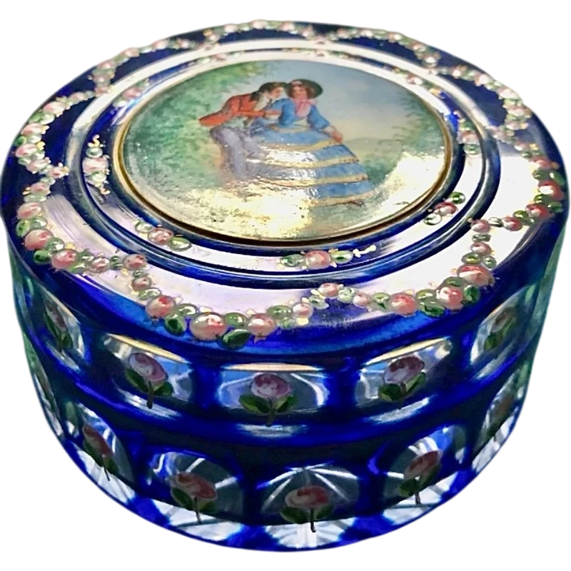 Box made of coated and faceted crystal with enamel decorations featuring floral motifs