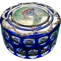 Box made of coated and faceted crystal with enamel decorations featuring floral motifs