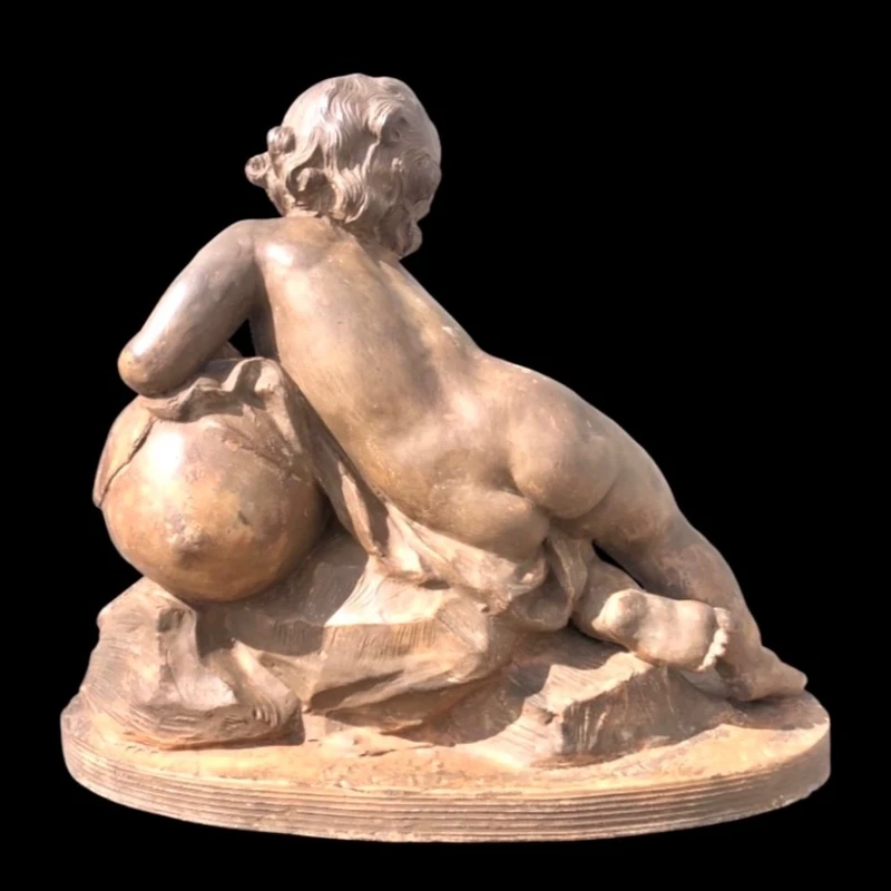 A terracotta sculpture depicting a child pouring liquid from a vase.