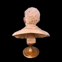 Terracotta bust depicting a young Giosue’ Carducci. Signed: G. Cerrone.