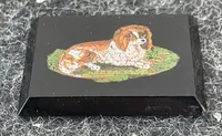 micromosaïque rectangulaire représentant un chien.