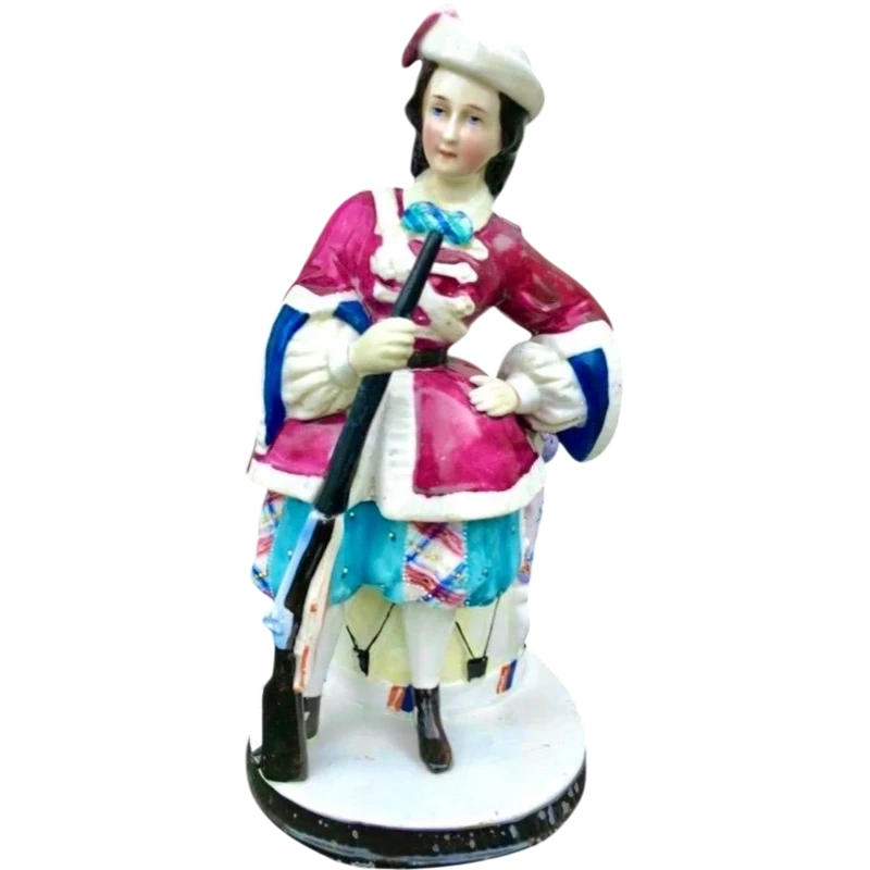 Porcelain tobacco box featuring a female figure with a rifle and a drum.