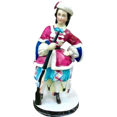 Porcelain tobacco box featuring a female figure with a rifle and a drum.