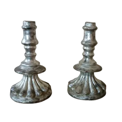 A rare pair of antique 17th-century silver-plated terracotta candlesticks