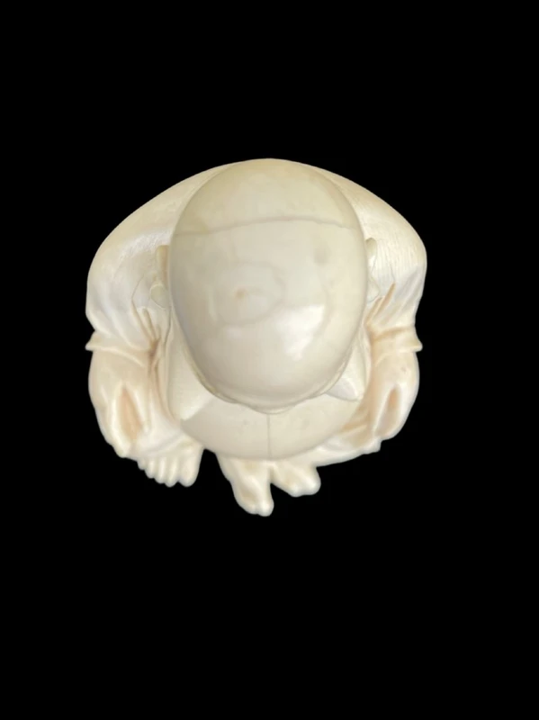Ivory sculpture depicting Buddha. Signed.
