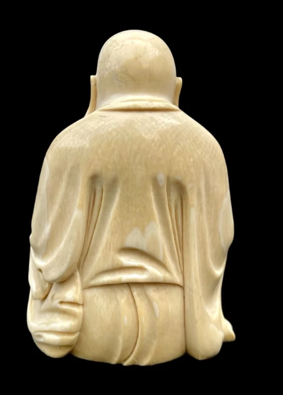 Ivory sculpture depicting Buddha. Signed.