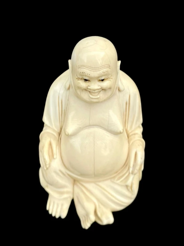 Ivory sculpture depicting Buddha. Signed.