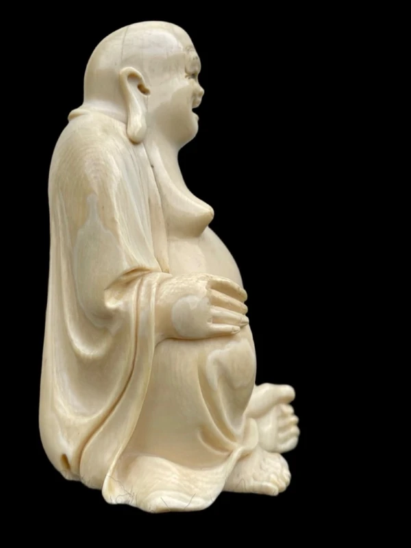Ivory sculpture depicting Buddha. Signed.