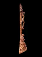 A small boxwood sculpture depicting Christ on the Cross and Mary Magdalene.