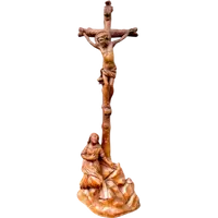 A small boxwood sculpture depicting Christ on the Cross and Mary Magdalene.