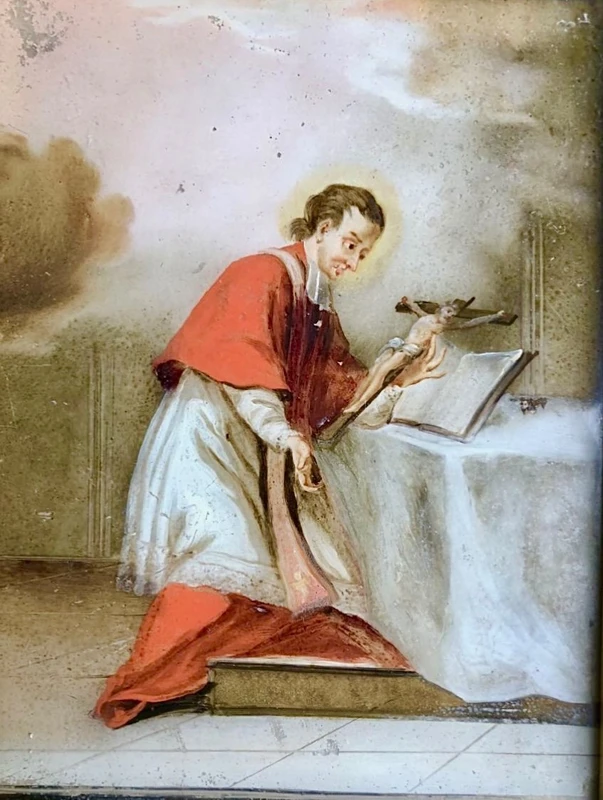 Peinture sur verre représentant saint Louis de Gonzague. Cadre en bois doré orné de motifs rocaille.