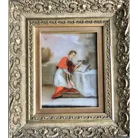 Peinture sur verre représentant saint Louis de Gonzague. Cadre en bois doré orné de motifs rocaille.