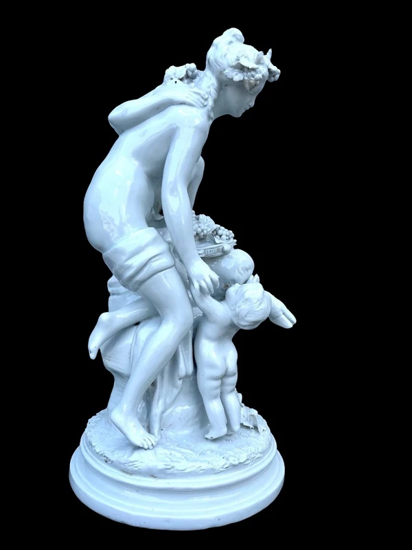 Large porcelain sculpture (masso bastardo) depicting a faun and a nymph with a cherub