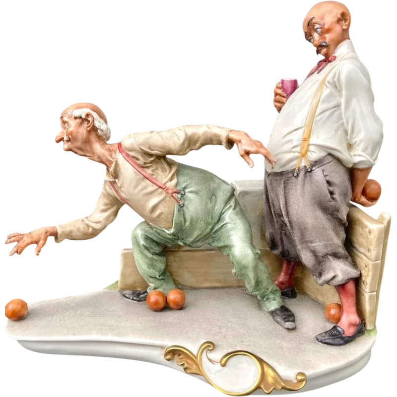 A caricature-style porcelain sculpture depicting bocce players.