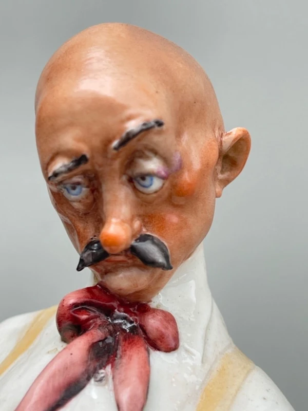 A caricature-style porcelain sculpture depicting bocce players.