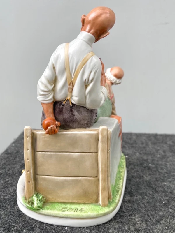 A caricature-style porcelain sculpture depicting bocce players.