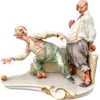 A caricature-style porcelain sculpture depicting bocce players.