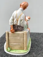 A caricature-style porcelain sculpture depicting bocce players.