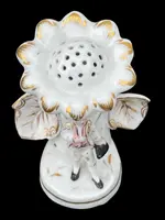 Polychrome porcelain toothpick holder featuring a male figure and shaped like a flower.