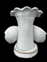 Polychrome porcelain toothpick holder featuring a male figure and shaped like a flower.
