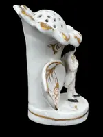 Polychrome porcelain toothpick holder featuring a male figure and shaped like a flower.