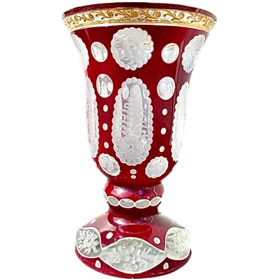 Double-walled glass with bubbles and cutwork featuring stylized plant motifs and gold accents.
