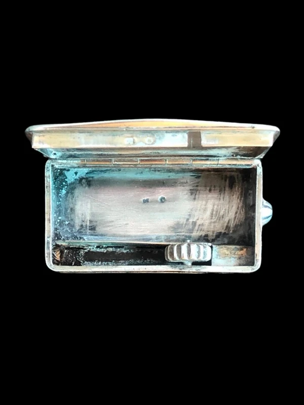Silver matchbox with engraved floral motifs