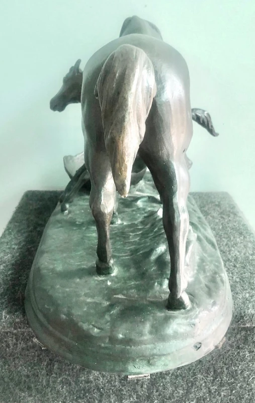 Bronze sculpture depicting a mare with her foal