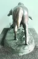 Bronze sculpture depicting a mare with her foal