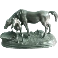 Bronze sculpture depicting a mare with her foal