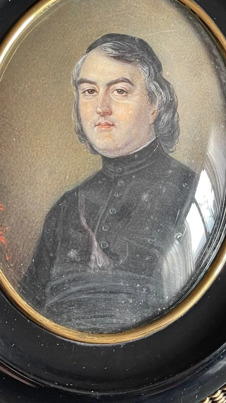 Miniature oil painting on bone plate depicting a male figure.