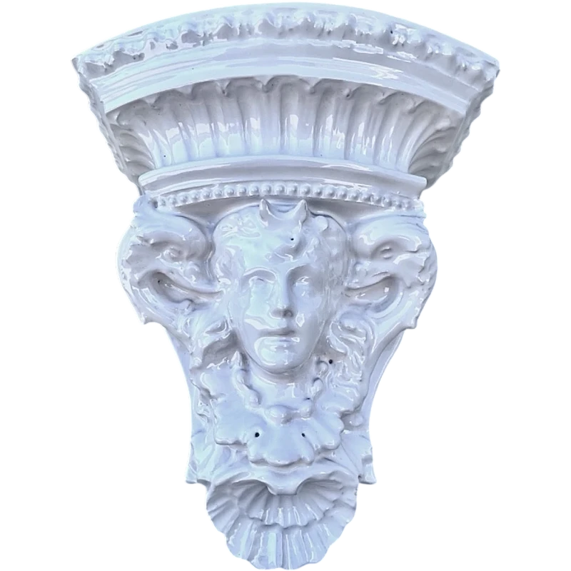 White majolica shelf featuring a female figure, dolphins, and geometric marine motifs. Faenza