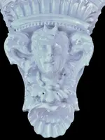 White majolica shelf featuring a female figure, dolphins, and geometric marine motifs. Faenza