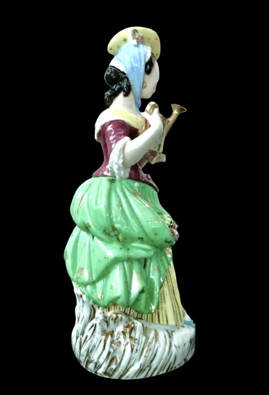 Polychrome porcelain tea pot nightlight depicting a lady with a watering can