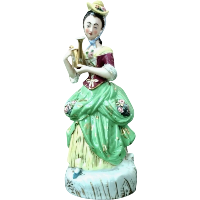Polychrome porcelain tea pot nightlight depicting a lady with a watering can