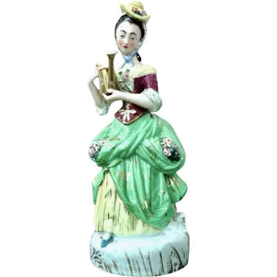 Polychrome porcelain tea pot nightlight depicting a lady with a watering can